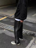 AIDASE  -  American Street Style Loose Side Stripe Casual Pants Men High Street BF Design Sense Splicing Zipper Long Trousers Trendy aidase-shop