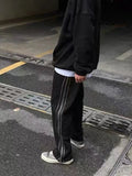 AIDASE  -  American Street Style Loose Side Stripe Casual Pants Men High Street BF Design Sense Splicing Zipper Long Trousers Trendy aidase-shop